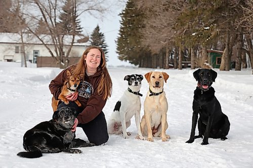 26022026
Sarah Mills, owner of Forrest River Canines, with her dogs Davidson, Voltage, Zero, June and Thor at her boarding, grooming and training facility north of Forrest, Manitoba in February. Mills and her dogs will be performing as part of the Canine Circus at the 2026 Royal Manitoba Winter Fair. 
(Tim Smith/The Brandon Sun)