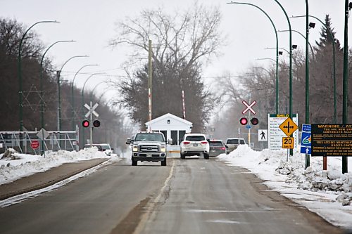 Railway crossing lights flash in front of the north gate of CFB Shilo on Wednesday afternoon. (Matt Goerzen/The Brandon Sun)