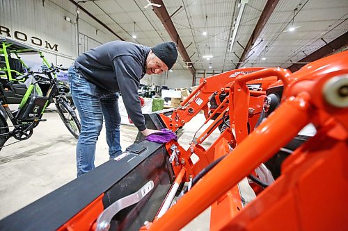 Virden Ag owner Matt Hipwell wipes down a brand new Kioti front-end loader from South Korea on Thursday afternoon at the Keystone Centre. The Westman business joins dozens of other companies as participants in the Brandon Home and Leisure Show, which starts today. The three-day event is a must-see for anyone looking for home renovation and residential improvement ideas, and includes free family entertainment, a golf simulator, and a speaker series. (Matt Goerzen/The Brandon Sun)