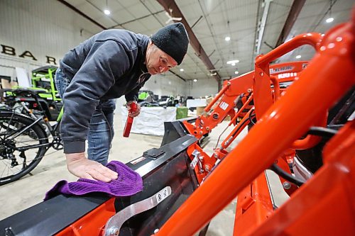 Virden Ag owner Matt Hipwell wipes down a brand new Kioti front-end loader from South Korea on Thursday afternoon at the Keystone Centre. The Westman business joins dozens of other companies as participants in the Brandon Home and Leisure Show, which starts today. The three-day event is a must-see for anyone looking for home renovation and residential improvement ideas, and includes free family entertainment, a golf simulator, and a speaker series. (Matt Goerzen/The Brandon Sun)