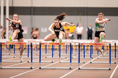 MIKAELA MACKENZIE / FREE PRESS

Sarah Feschuk (left), Laetitia Corriveau-Tozzi and Natalie Thompson compete in the 60m hurdles at the U Sports track and field championships at the University of Manitoba on Thursday, March 5, 2026.

Standup.
Free Press 2026