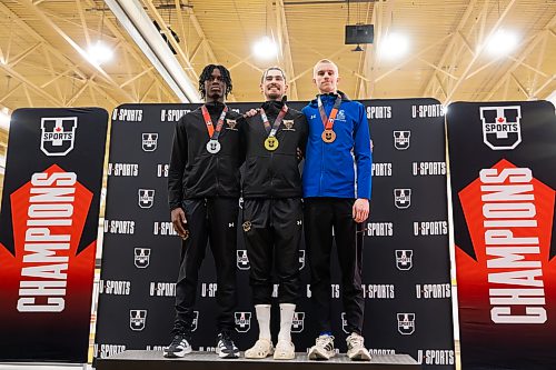 MATTHEW MERKEL / FREE PRESS
University of Manitoba Bisons' Daxx Turner and Adebare Adegbosin captured gold and silver Saturday in the triple jump at the 2026 U Sports Track and Field Championships at the U of M's James Daly Fieldhouse. From left: Bisons' Adebare Adegbosin (silver), Bisons' Daxx Turner (gold), Lethbridge Pronghorns' Lauchlan Irish (bronze).