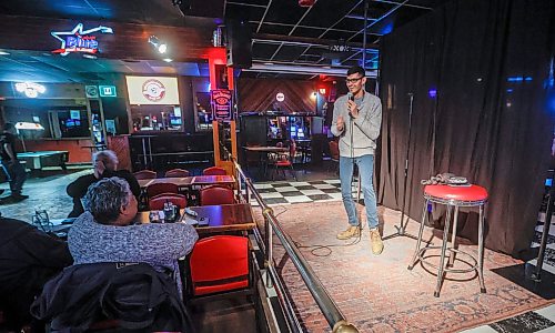 JOHN WOODS / FREE PRESS
Dev Oza, radio traffic host, and part time standup comedian performs a routine at an open stage at The Marion Tuesday, March 10, 2026. 

reporter: dave