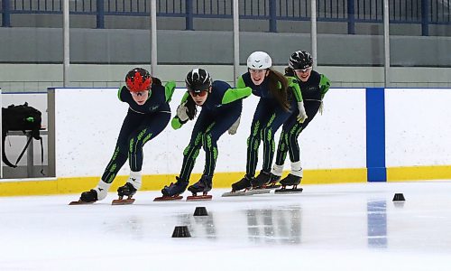 Zoe Forbes (red Maple Leaf on her helmet), Hayden Dietrich Pulleyblank (black helmet, black glasses), Madelyn Nairn (white helmet) and Sophia Forbes (black helmet, white glasses) negotiate a turn during a Westman Speed Skating Club practice at the Sportsplex on Thursday evening. (Perry Bergson/The Brandon Sun)

