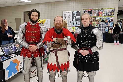 Historical Armoured Combat Sports Association members Julian Kresz (left), William Baliko, and Stuart Witherden dress in medieval armour and stand in the UCT Pavilion at the Keystone Centre during the Westman Gaming Expo on Saturday afternoon. Photos: Abiola Odutola/The Brandon Sun
