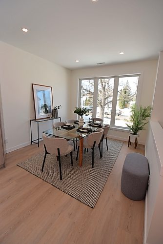 Todd Lewys / Free Press
A huge window behind the expansive dining area lets in tons of natural light in Casa Mia Living’s two-story River Heights North design.