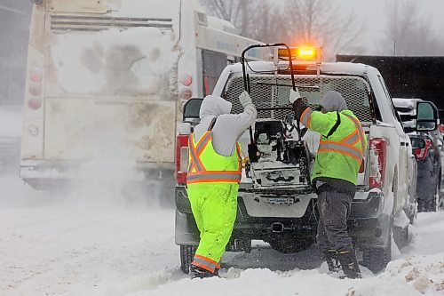 19122025
Workers with the City of Brandon work tirelessly to clear snow from the sidewalks at Princess Avenue and Sixth Street in Brandon during a snow storm in December. 
(Tim Smith/The Brandon Sun file)
