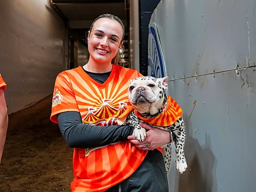 Brenna and her dog pose backstage preparing for their upcoming show at the Keystone Centre on March 30.( Weichen Zhang / The Brandon Sun)