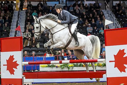 Marion Ostmeyer of Germany rides her horse, Revival, during the Wawanesa Insurance Accumulator horse jumping competition at the Royal Manitoba Winter Fair at Assiniboine Credit Union Place on Monday evening. (Thomas Friesen/The Brandon Sun)