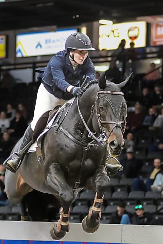 Brookdale's Abbey McLeod competes in the Wawanesa Accumulator show jumping competition at the Royal Manitoba Winter Fair on Monday. (Thomas Friesen/The Brandon Sun)