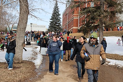 Parents support their wards as they look for eggs hidden across the lawns of Assiniboine College's North Hill Campus during the college's annual Easter Eggstravaganza on Saturday afternoon. Photos: Abiola Odutola/The Brandon Sun