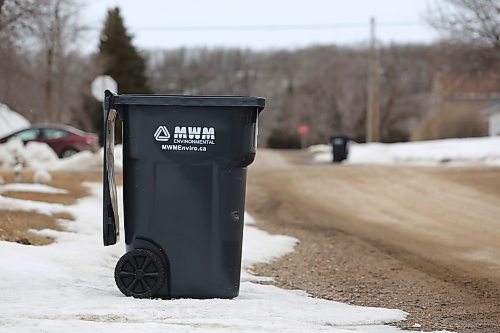 A garbage container on the side of the road in Minnedosa in April. The town introduced garbage containers in 2025 for bags to be placed into, having previously collected garbage bags off the side of the road. The town CAO said she is hopeful the new collection method will decrease the number of crows and magpies in town. (Connor McDowell/The Brandon Sun)