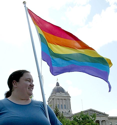 JOE BRYKSA/WINNIPEG FREE PRESS Local-(see Pride day story)- Alissa Wilts proudly flys pride flag at Pride day parade at Manitoba Legislature- June 08, 2003