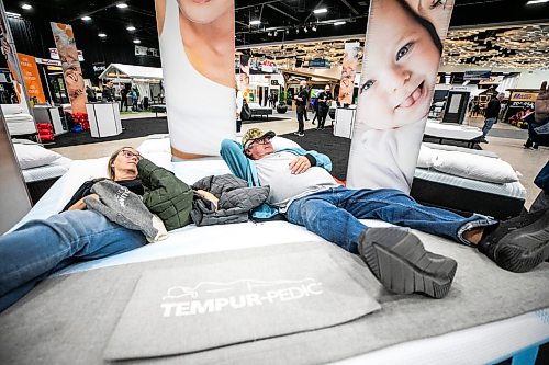 MIKAELA MACKENZIE / FREE PRESS
	
Kim and Ernie Marion put their feet up while trying out a tempurpedic mattress at the Home and Garden Show at the RBC Convention Centre on Thursday, April 9, 2026.

Standup.
Free Press 2026