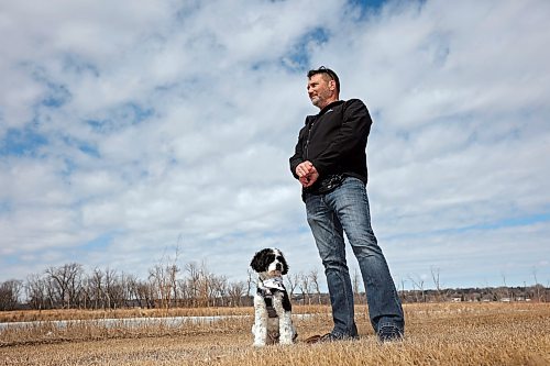 Canadian Armed Forces veteran Joel Langley, co-founder of Paws 4 Valour, with his dog, Bandit, at Dinsdale Park in Brandon on Friday afternoon. Paws 4 Valour provides free dog-training and peer-support programming to promote mental health and peer connection to military members, veterans and first responders, as well as their dogs. See story on Page A5. (Tim Smith/The Brandon Sun)