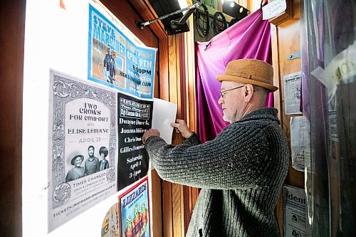 MIKAELA MACKENZIE / FREE PRESS
	
John Scoles puts a poster advertising the upcoming 25th anniversary bash up on the door at the High and Lonesome Club on Friday, April 10, 2026.

For Ben Waldman story.
Free Press 2026