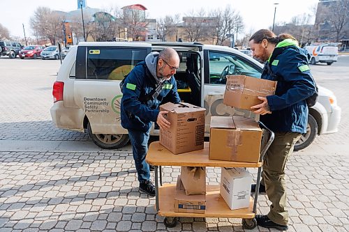 MIKE DEAL / FREE PRESS
Dallas Holden (right), manager of the Mobile Assist Connect (MAC) program with Downtown Community Safety Partnership (DCSP) along with Bryan Barker (left), Mobile Assist Connect (MAC) supervisor pick up some donations from Tall Grass Prairie Bread Company at The Forks during an early morning patrol with their van Thursday.
Reporter: Nicole Buffie
260409 - Thursday, April 09, 2026.