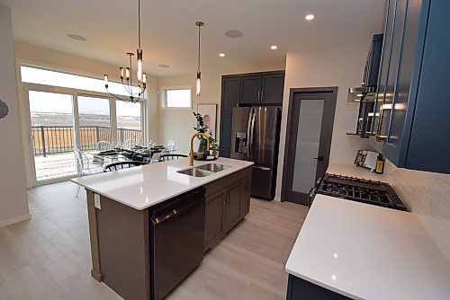 Todd Lewys / Free Press
A triple patio door behind the dining area not only lets in tons of natural light, but also provides access to a large backyard deck.
