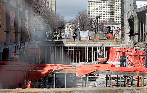 Ruth Bonneville  Free Press

Local Standup - Portage Place Dev

Work crews radically transform what used to be the centre court with clock tower of Portage Place  on Portage Ave. at Edmonton Street Tuesday.  

View through fencing on Portage at Edmonton. 

April 14th,  2026
