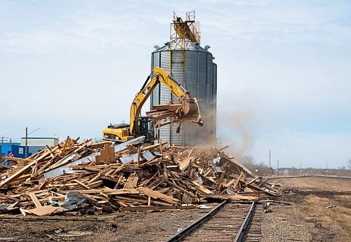 Mike Thiessen / Winnipeg Free Press
The remnants of the elevator are sorted into piles of wood and metal. The bins will remain where they are for the time being.
April 15