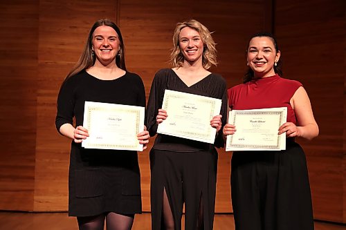 Forty-ninth Eckhardt-Gramatté National Music Competition first-place winners Aemilia Moser (centre) pose for a picture with second-place Kendra Dyck (left) and third-place Camille Labonté (right) after the competition in the Lorne Watson Recital Hall at Brandon University on Sunday afternoon. (Abiola Odutola/The Brandon Sun)