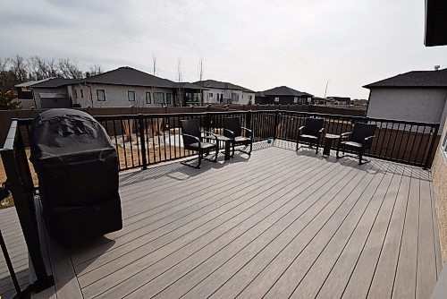 Todd Lewys / Free Press
There’s no lack of space to barbecue or visit with guests on the elevated backyard deck, which looks onto a beautifully landscaped yard with fire pit.