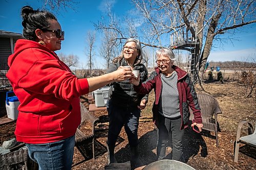 MIKAELA MACKENZIE / FREE PRESS
	
Christine Cyr (left), Louise May, and Naomi Gerrard say cheers before sampling cups of the in-progress syrup on Tuesday, April 21, 2026.

Standup.
Free Press 2026