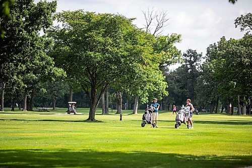 MIKAELA MACKENZIE / FREE PRESS
Jan Duncan (left) and Tracy Paluk head up the fairway while playing a round at Windsor Park Golf Course recently. 
