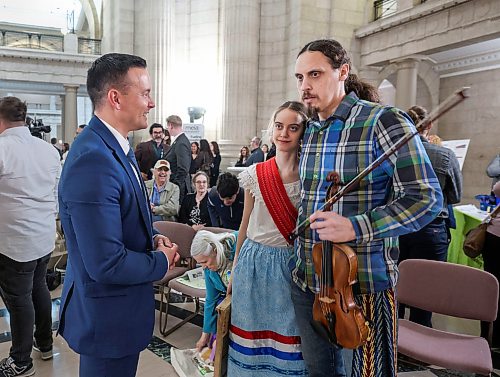 Ruth Bonneville Free Press
local - earth day at legislative building
Gilles Crevier and his daughter Sara chat with Environment Minister Mike Moyes,, after performing the Lemay Forest Waltz fin the Rotunda at the Legislative Building during Earth Day Celebrations Wednesday.
See story by Gabby
April 22nd, 2026