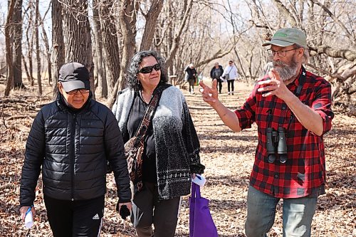 Dora Paul and Anne Paul chat with Barnes as they tour the maple syrup operation on Thursday. The group got to sample maple sap, learn about the different trees in the forest and all about maple sap collection and the process of turning the sap into syrup. (Tim Smith/The Brandon Sun)