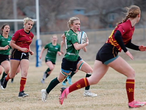 Sophia Smigelski (11) carries the ball for the Dauphin Clippers during their Westman High School Rugby girls game against the host Crocus Plainsmen at John Reilly Field on Tuesday. Dauphin steamrolled over Crocus 80-0. (Massimo De Luca-Taronno/The Brandon Sun)