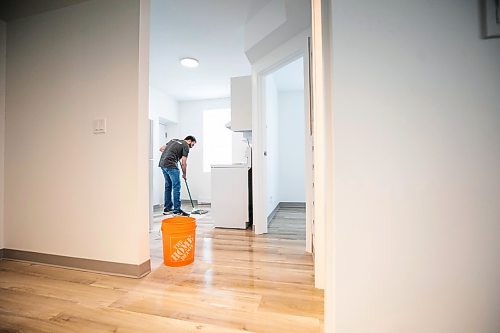 MIKAELA MACKENZIE / FREE PRESS
Volunteer Scott Jodoin mops in the new transitional housing complex at 480 Young Street on Thursday, April 30, 2026.
For Scott story.
Free Press 2026