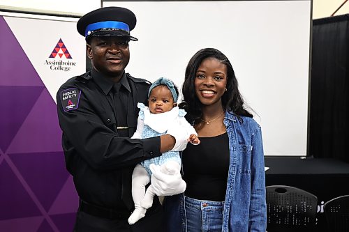 Assiniboine College’s Public Safety program graduate Osahon Ebose poses for a picture with his wife, Enimielen, and baby shortly after graduation ceremony on Friday morning. (Abiola Odutola/The Brandon Sun)