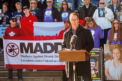 MIKE DEAL / FREE PRESS
MADD Winnipeg president, Trevor Ens, speaks after the procession arrived to the Manitoba Legislative building from steps.
A procession of people affected by drunk driving, including relatives, friends and community supporters, join MADD Winnipeg for a memorial procession from The Forks down Broadway to the Manitoba Legislative building, on the inaugural Victims of Impaired Driving Day in Manitoba.
Reporter: Gabrielle Piche
260501 - Friday, May 01, 2026.