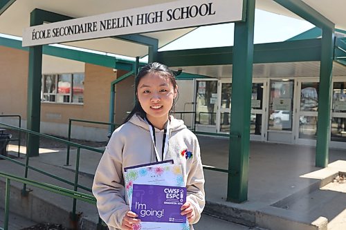 École secondaire Neelin High School Grade 10 student Angelina Zhang holds the plaque she won as one of the two runners-up at the 56th annual Western Manitoba Science Fair (WMSF) last month in front of the school on Friday afternoon. She received an all-expenses-paid trip to represent Western Manitoba at the Canada Wide Science Fair 2026 in Edmonton from May 23 to 30. (Abiola Odutola/The Brandon Sun)