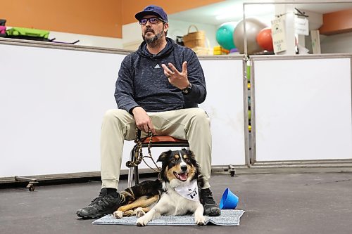 Ian Tait talks with the rest of the group while his border collie, Angus, takes a rest. (Tim Smith/The Brandon Sun)


