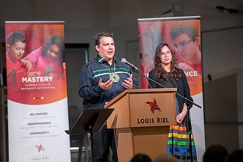 BROOK JONES/FREE PRESS
Louis Riel School Division hosts a renaming ceremony of École Sage Creek Bonavista to École Mazina-Giizhik in honour of the late justice Murray Sinclair at École Mazina-Giizhik in Winnipeg, Man., Wednesday, May 6, 2026. Pictured: Niigaan Sinclair who is the son of Murray Sinclair speaks about his late father during the renaming ceremony. Also pictured is Niigaan's daugther Sarah Fontaine-Sinclair.