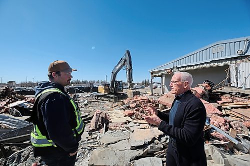 Spencer Griffin, left, operations manager at Alternative Group, speaks with Murray Chrysler Westman owner Doug Murray at the site of a demolished Brandon Chrysler Dodge building. Following an expected week of demolition, work will begin on a new facility with expanded service bays, more storage space, and a better showroom, Murray said. The construction is expected to take 18 months on the new facility, and it will mark the consolidation of Brandon Chrysler Dodge and Murray Chrysler Westman. (Connor McDowell/The Brandon Sun) 