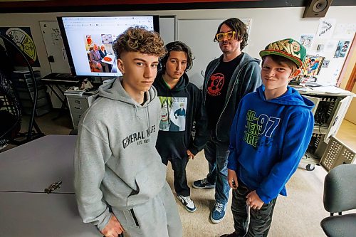 MIKE DEAL / FREE PRESS
(From left) Nathaniel Thiessen Unger, Julian Evans, teacher Devin King, Kayden Tully.
Grade 8 students at General Wolfe School are spending every day this month trying to decipher AI-generated clickbait, music and photos from human-generated material in teacher Devin King’s classroom.
Reporter: Maggie Macintosh
260505 - Tuesday, May 05, 2026.