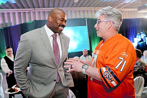Former NFL defensive lineman and evening keynote speaker Israel Idonije shares some memories with football coach Kevin Grindey — who used to coach Idonije at Vincent Massey High School in Brandon — during the inaugural Keystone Centre Foundation dinner on Thursday in the facility’s Canada Room. (Matt Goerzen/The Brandon Sun)