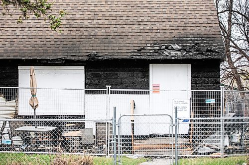 MIKAELA MACKENZIE / FREE PRESS
	
Melanie Flett with her car and the burned home on Lock Street on Friday, May 15, 2026.

For Morgan story.
Free Press 2026