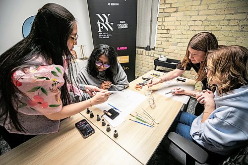 MIKAELA MACKENZIE / FREE PRESS
Joanne Roberts (left), AV Kitching, Jillian Sheedy, and Shae-Lynn Murray work on molding and smoothing the clay rings around their mandrels during a silver ring-making workshop on Monday, March 23, 2026.
For AV story
Free Press 2026