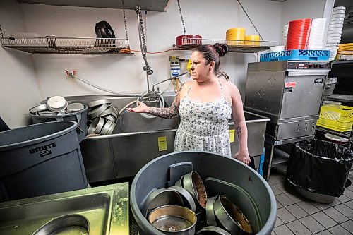 MIKAELA MACKENZIE / FREE PRESS
Linda Peters, owner of Goodies Bake Shop, shows the pileup of dishes on Friday, May 22, 2026. Theyնe been without water for two days and counting owing to a water main break, and it's causing significant issues for the bakery.
For Malak story.
Free Press 2026