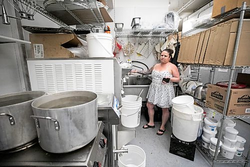 MIKAELA MACKENZIE / FREE PRESS
	
Linda Peters, owner of Goodies Bake Shop, shows how theyղe heating water on Friday, May 22, 2026. Theyնe been without water for two days and counting owing to a water main break, and it's causing significant issues for the bakery.

For Malak story.
Free Press 2026