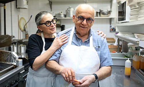 Ruth Bonneville Free Press
BIZ - Pappas closing after 50 years
Photo of Bob and Maria Papasotiriou, sharing a quick embrace on their last day of business Friday.
After 50 years serving the community at 3318 Roblin Blvd., Bob and Maria Papasotiriou are retiring and closing Pappas Greek Food.
Story by Aaron.
May 22nd,, 2026