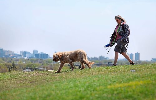 Ruth Bonneville  Free Press

Standup - Dog walker 

Heike Eidse walks her 11-year-old Australian labradoodle, Finnegan, along the crest of Westview Park (Garbage Hill) on a sunny Monday afternoon, with the blooming Winnipeg skyline in the background.

May 25th,, 2026
