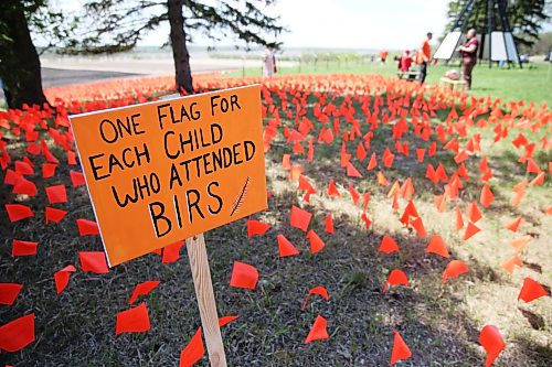 Orange flags flap in the wind during Wednesday's National Day of Action event. (Matt Goerzen/The Brandon Sun)