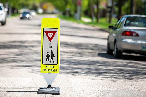 MIKAELA MACKENZIE / FREE PRESS
	
New in-street crosswalk signage in front of Frontenac School on Thursday, May 28, 2026.

For Maggie story.
Free Press 2026