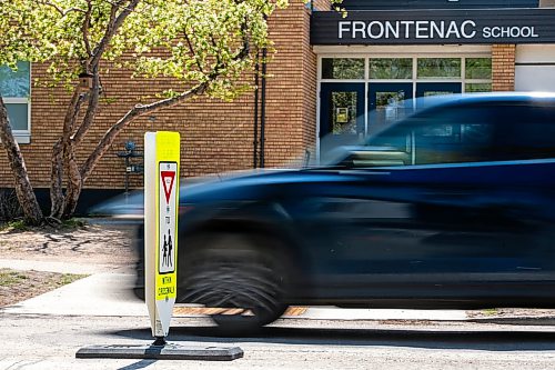 MIKAELA MACKENZIE / FREE PRESS
	
New in-street crosswalk signage in front of Frontenac School on Thursday, May 28, 2026.

For Maggie story.
Free Press 2026