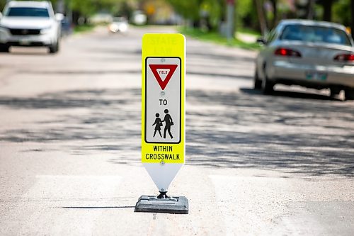 MIKAELA MACKENZIE / FREE PRESS
	
New in-street crosswalk signage in front of Frontenac School on Thursday, May 28, 2026.

For Maggie story.
Free Press 2026
